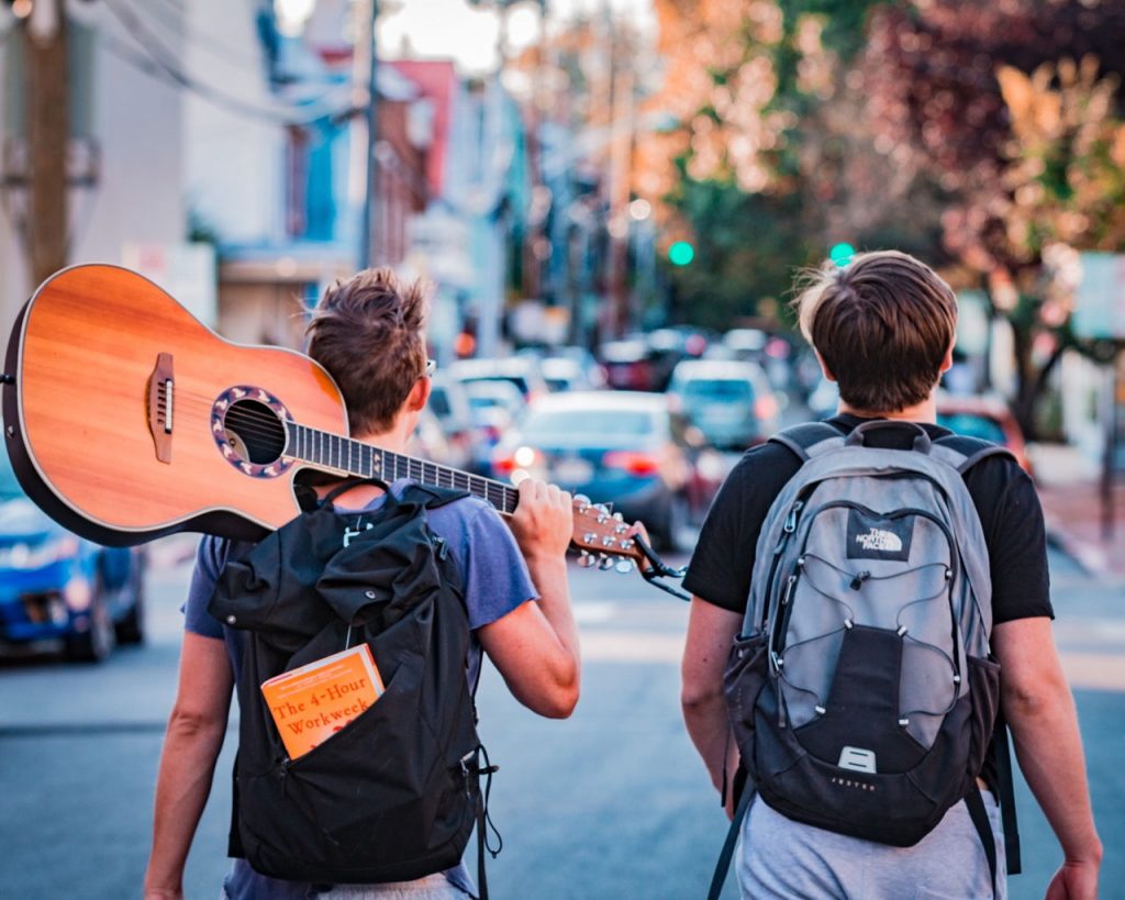 two guys walking down the street