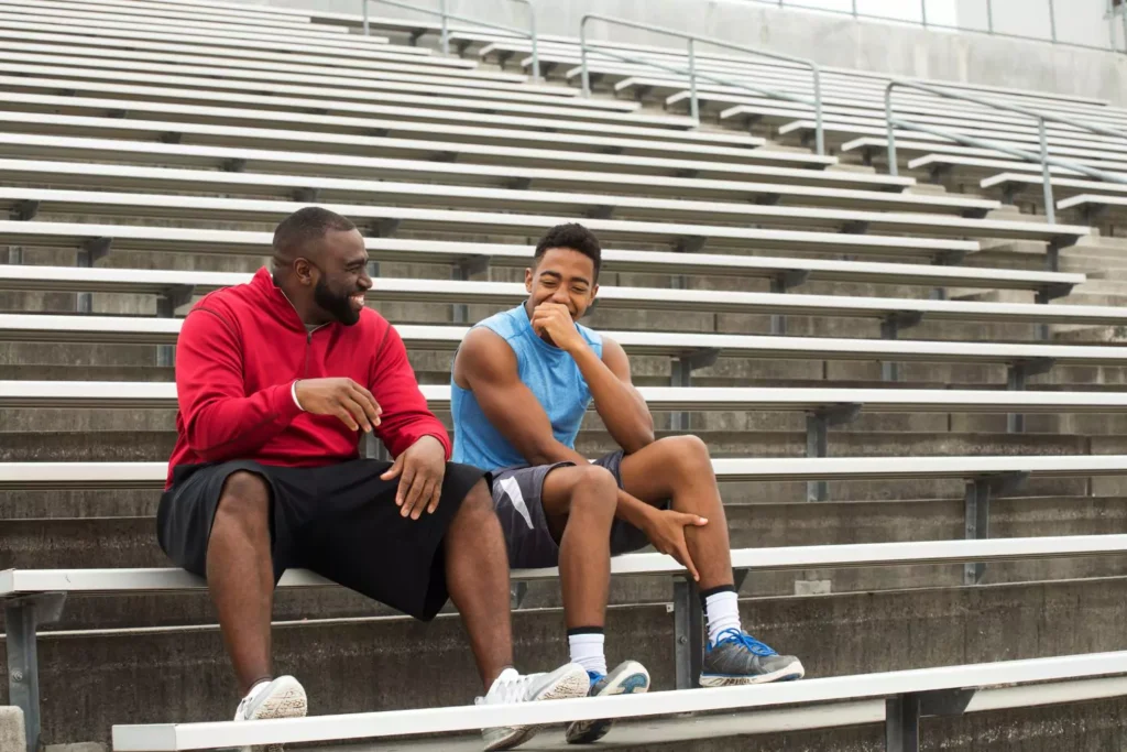 an older guy mentoring a younger guy