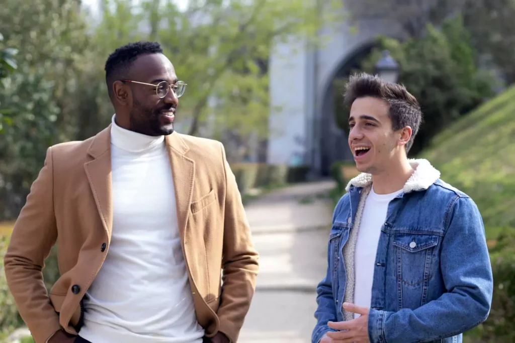 two guys talking, friends of sinners