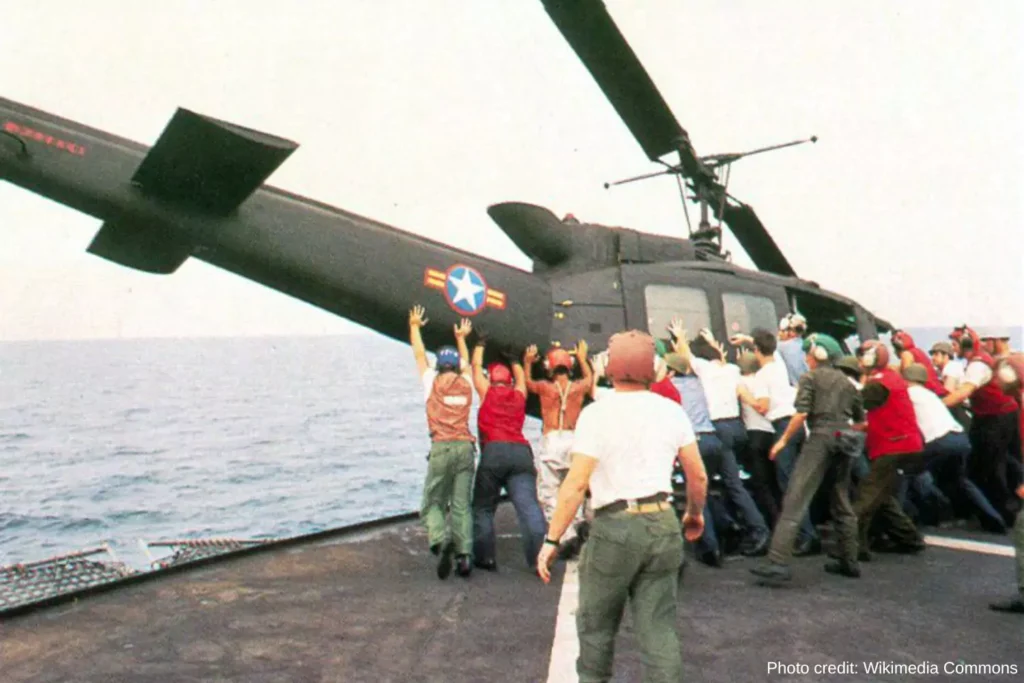 a helicopter is pushed overboard, removing the clutter on the ship