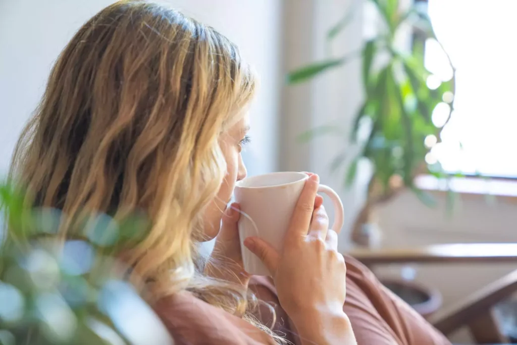 A woman drinking coffee, she wants her life to be one of consecrated singleness