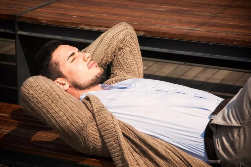 A man laying on a bench. God has a wonderful plan for him.
