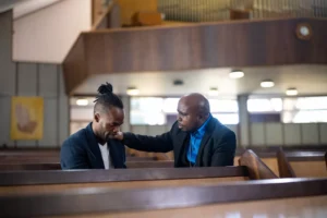 a congregant gaining wisdom from his pastor