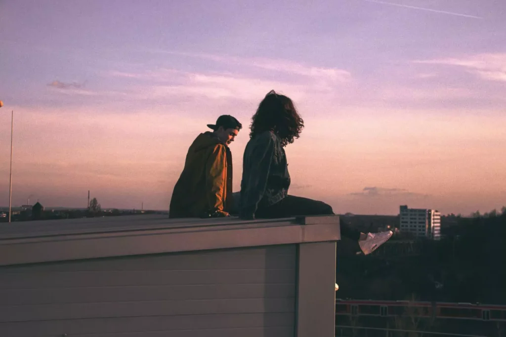 a man sitting next to a woman he is not attracted to