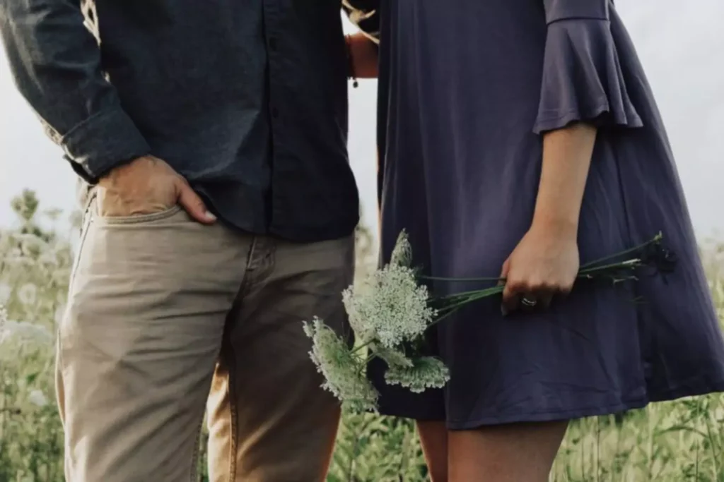 a man and woman standing next to each other, discussing sexual union