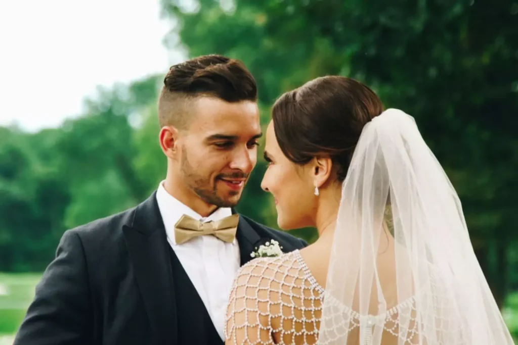 a bride and groom looking at each other, hoping for sexual intimacy on their wedding night