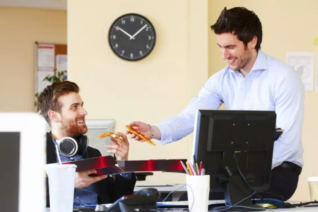 Two guys at work, sharing pizza and the gospel