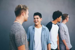 men talking and smiling, they stir each other up to do good works