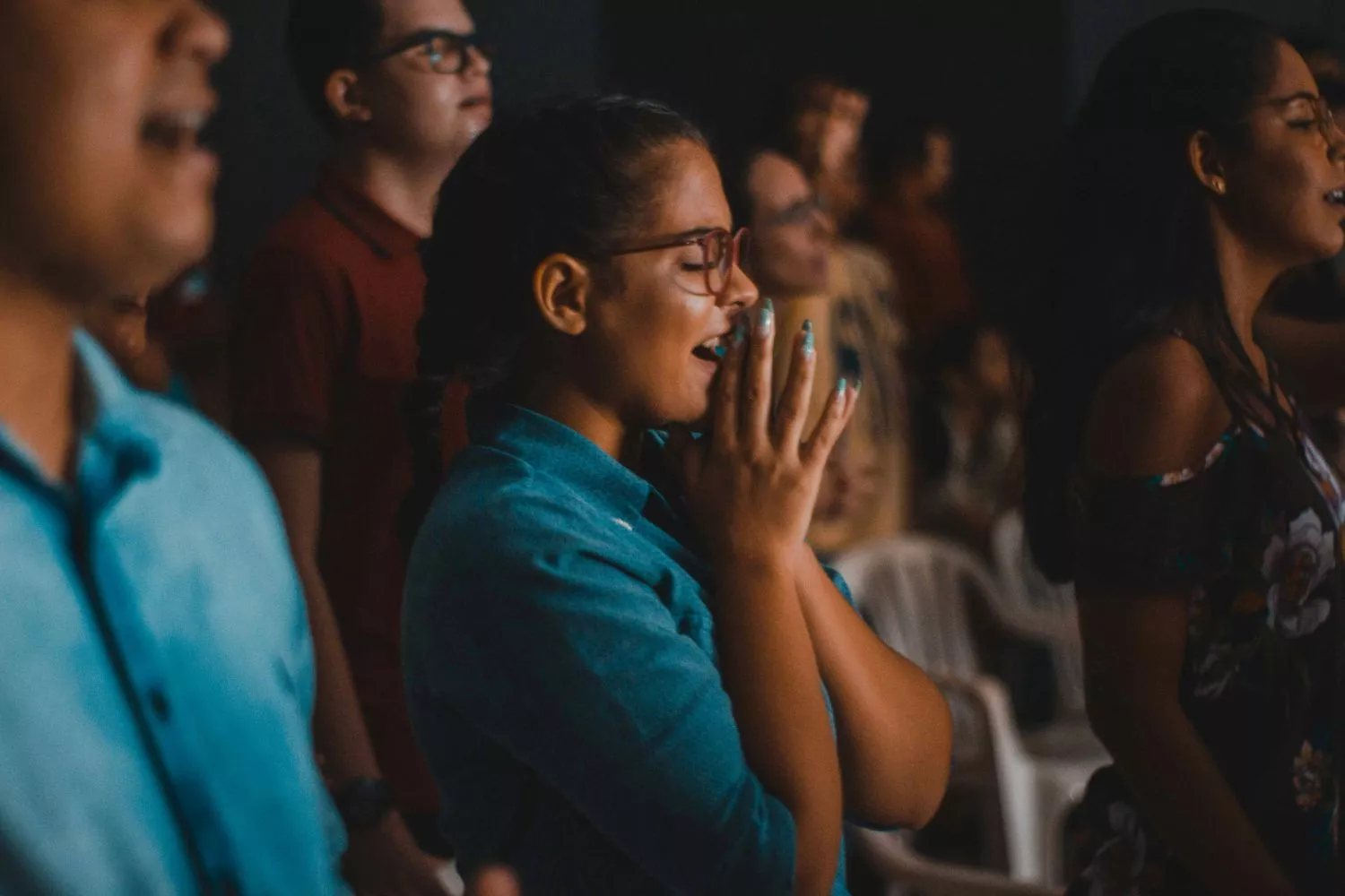 a woman singing in church