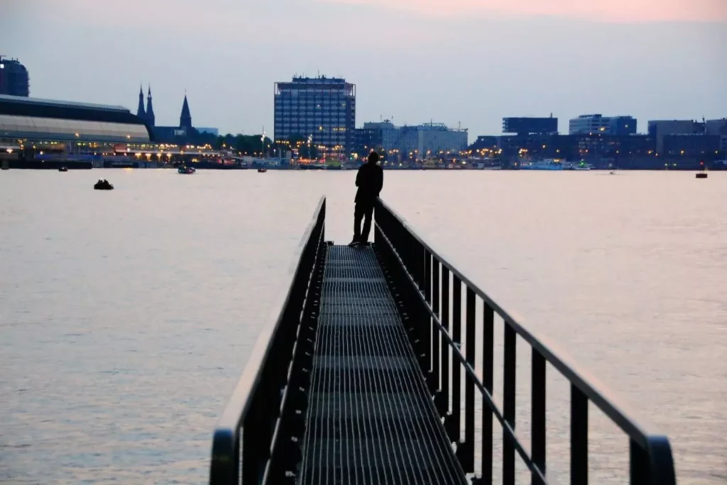a man standing on a pier fighting for purity