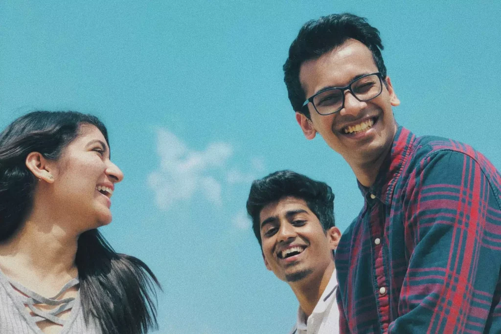 a woman making friends with two guys