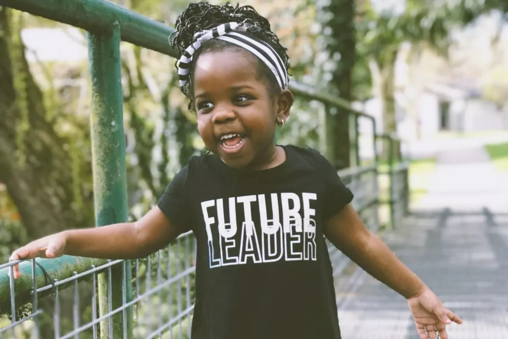 a little girl with a shirt that reads Future Leader, she will be in leadership one day