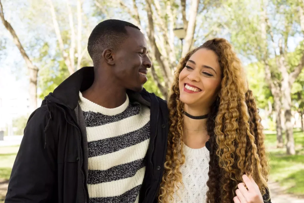 a man and woman in a dating relationship, walking