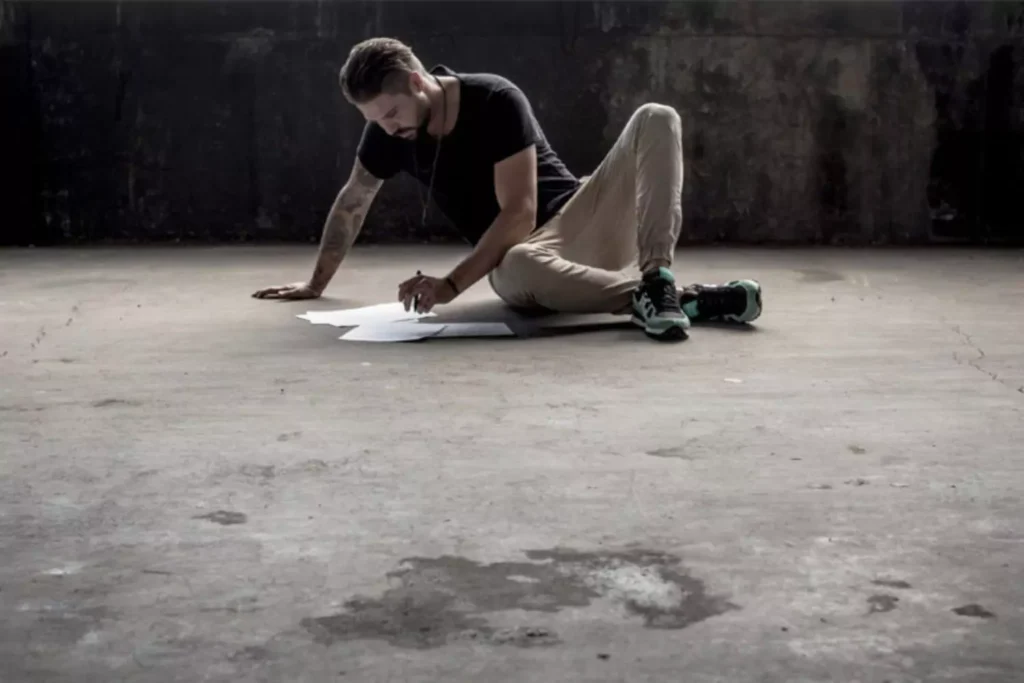 a man doing some of his work on the ground