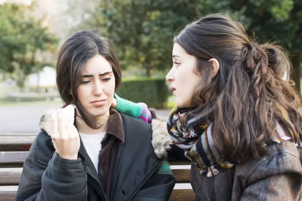 one woman listening to another as she grieves