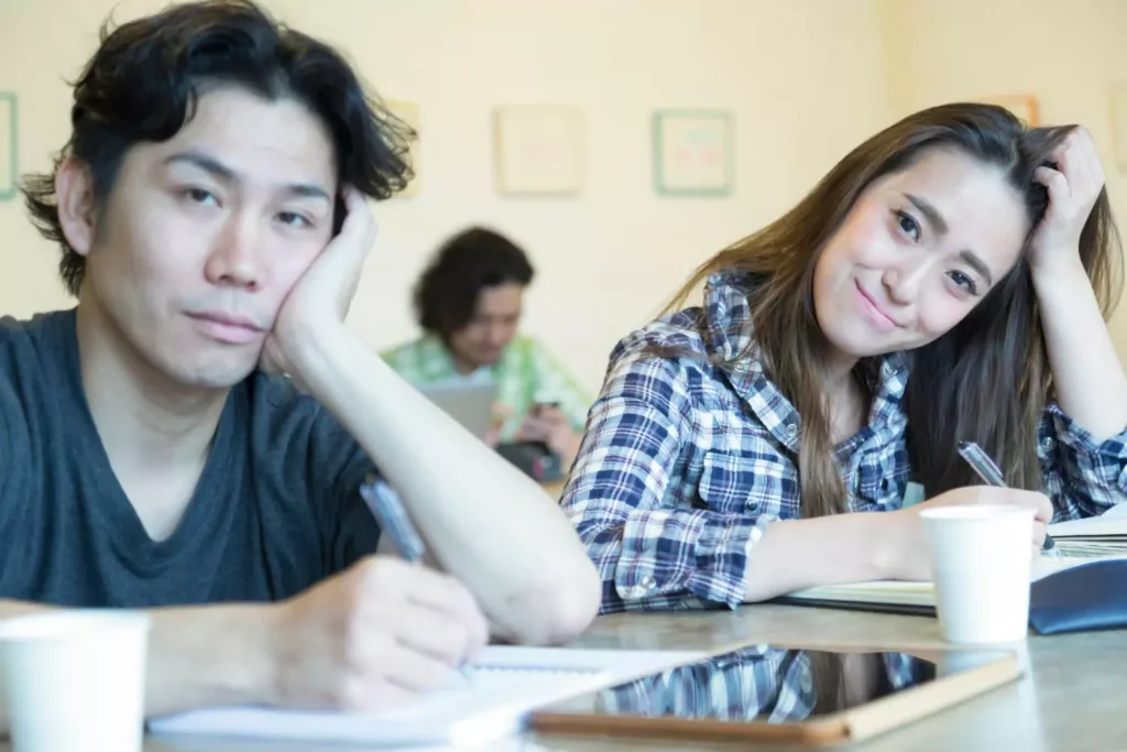 a man looking disgruntled and a woman smiling, different personalities
