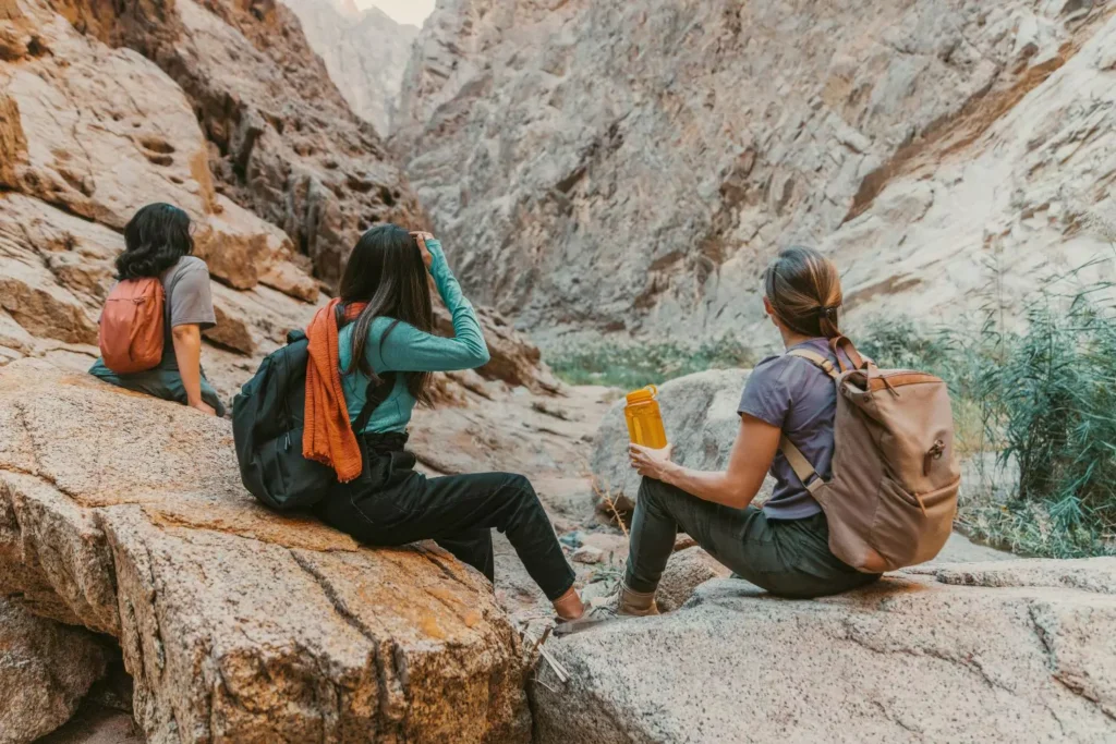 3 women on a hike, part of their monthly ritual